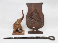 African tribal ebony carved walking stick with loop handle and the shaft carved in the form of the