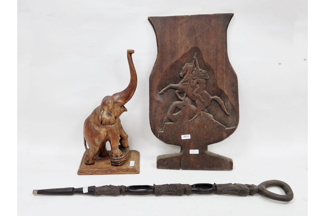 African tribal ebony carved walking stick with loop handle and the shaft carved in the form of the