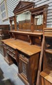 Victorian mahogany breakfront mirrored back sideboard, the back with dentil moulded pediment,