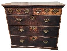 Early 19th century oak chest of two short over three drawers, each with brass drop loop handles with