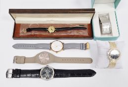 Lady's Gucci gilt metal strap watch, the circular dial with roman numerals, in fitted case with