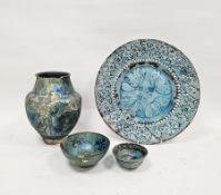 Group of Persian turquoise glazed pottery to include an Iranian 18th-19th century pierced charger,