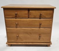 Modern pine chest of two short over two long drawers, on bun feet, 71cm high x 82cm wide x 40cm