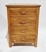 Modern oak chest of four drawers with curved metal handles, on short square legs, 89cm high x 63cm