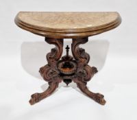 Victorian figured walnut demi-lune card table, the inlaid fold-over top opening to a burgundy