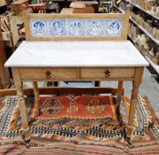 Late 19th century stripped pine marble-topped washstand with tile top mount, two short drawers,