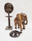 African hardwood Ashanti Aqua-Ba fertility doll, 44cm high, an African hardwood carved elephant