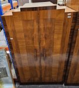Art Deco walnut veneered and rosewood effect linen press, with stepped pediment, the two panel doors