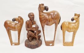Three African wooden carved zebras, each carved to the bottom 'John', tallest 52cm high and an