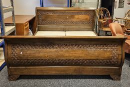 Simon Horn stained wooden superking sleigh bed with carved floral motifs to headboard, footboard and