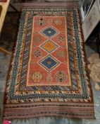 19th century red ground kilim with three central lozenges, eight elephant's foot guls and multiple