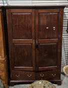 George III mahogany housekeeper's cupboard, the moulded cornice over two panel doors opening to an