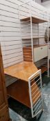 Mid-century Ladderax stacking unit comprising a four tier section with three shelves and a