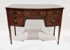 Mahogany bow-front sideboard in the Regency manner, with an arrangement of central drawer flanked by