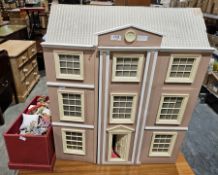 20th century doll's house, the doors opening to a fitted interior with various furniture and