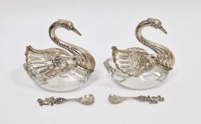 Pair of German white metal and glass salts in the form of swans with articulated wings, 7cm high and