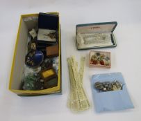 Quantity of assorted costume jewellery, including brooches, necklaces, two cap badges for the