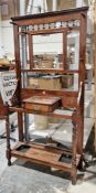 Late 19th / early 20th century mahogany hallstand, the mirrored back with six turned wooden coat