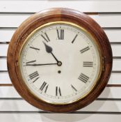 Station style circular wall clock, the mahogany case having a white dial with single winding hole