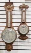Two late 19th century carved walnut cased barometers, both British made with silvered dials and