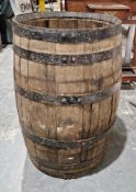 Large coopered oak and iron bound barrel, with hole for tap, 89cm high x approximately 57cm diameter