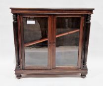 19th century mahogany low glazed bookcase, the twin glazed doors flanked by fluted turned columns,