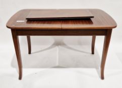 Early 20th century mahogany extending dining table, the top with rounded ends extending out with one