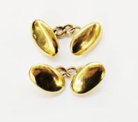 Pair of gold cufflinks with polished oval form with chain links marked 18 to the heads and 15ct to
