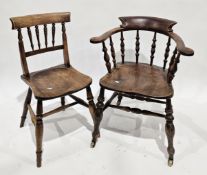 Victorian elm seated bow elbow chair with turned spindle back, on turned baluster legs terminating
