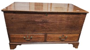 18th century oak mule chest, the hinged lid opening to an empty space, the two drawers below with