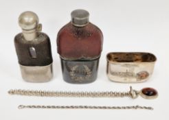 Two 19th / early 20th century silver plate and glass hip flasks, both with partial leather covers
