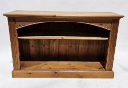 Modern pine two-tier bookcase, with curved frieze and single shelf, 76cm high x 122cm wide x 35cm