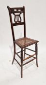 19th century child's music chair, with bar back, lyre-shaped splat and cane seat, on tall turned