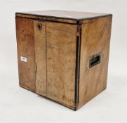19th century burr walnut and ebony table top cabinet, the two plain panel doors opening to three
