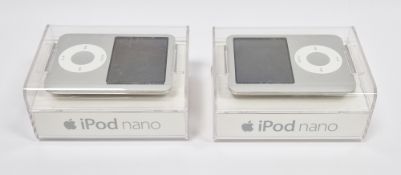 Two Apple iPod 4GB silver Nanos, both unopened and still sealed within their original retail boxes
