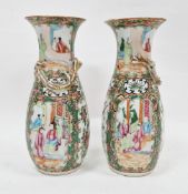 Pair of 19th century Chinese Canton famille rose baluster vases, each moulded with scrolling gilt