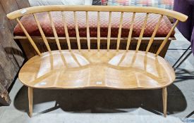 Mid-century Ercol beech and elm love seat/two-seater bench with turned spindle back and curved