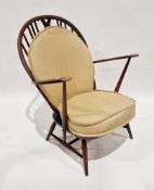 Ercol elm and beech wood open armchair in the fleur de lys pattern, with seat and back pads, Ercol