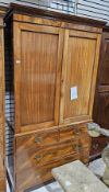 Early 19th century mahogany linen press (later converted to a wardrobe), the moulded cornice over
