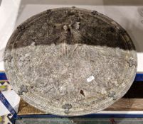 Composite stone shield-shaped garden ornament of domed form, cast in the Renaissance-style with a