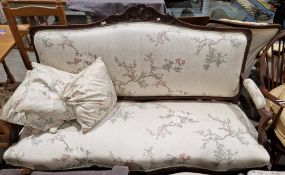French rosewood salon suite comprising a settee and pair of side chairs, each with foliate carved