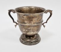Silver small twin handled trophy, rubbed London hallmarks, marked to base Goldsmiths & Silversmiths,