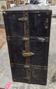 Early 20th century metal bound travelling wardrobe trunk, with leather handles, opening to an