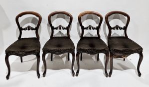 Set of eight Victorian mahogany balloonback dining chairs, each with pierced carved back rails,