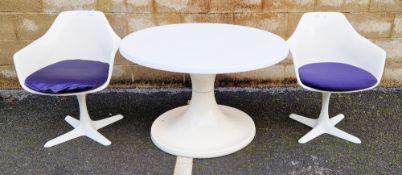 Pair of mid-century Arkana tulip swivel white dining room chairs with blue upholstered seats,