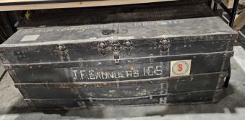 Large vintage steamer trunk, banded in studded iron and wood, stamped U.K. TRADE COMMISSIONER