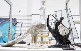 Lamp in the form of an Art Deco dancer in front of a swag glass panel and a silvered resin model