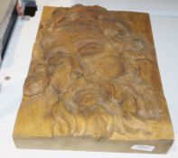 WITHDRAWN Wooden plaque, relief carved with the face of a bearded man, 35cm x 25cm