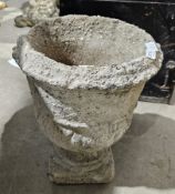 Composite stone planter in the shape of an urn