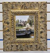 Pair of carved wood and gesso gilt frames of rectangular form, the wide borders with foliate